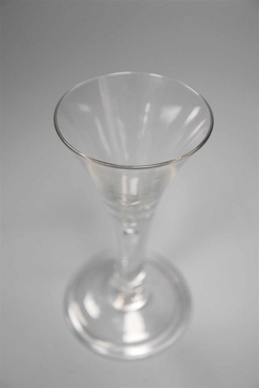 A drawn trumpet drinking glass, c.1740 on a folded foot, 15cm
